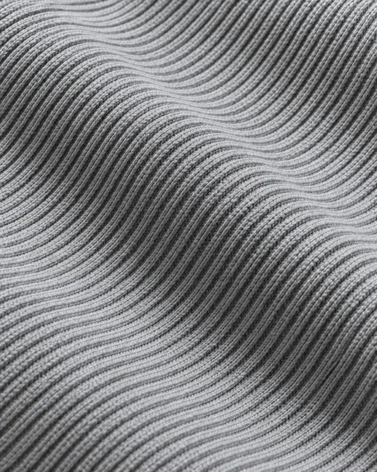 Close-up of the ribbed cotton knit on the Naval sweater in grey melee